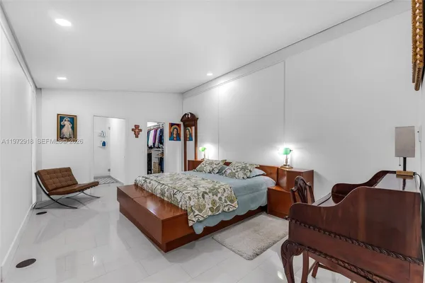 a living room with furniture and a lamp