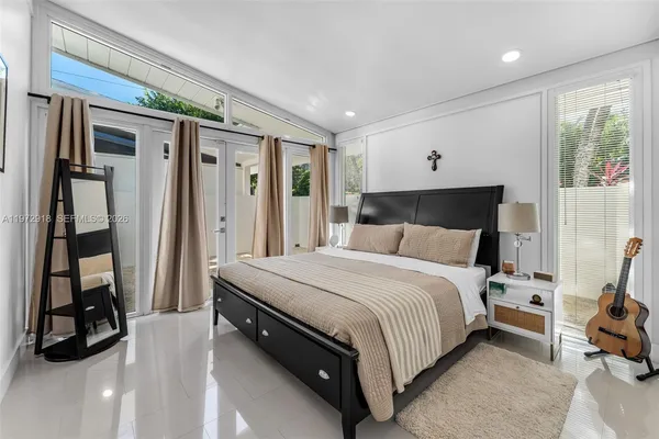 a bedroom with a bed and a walk in closet