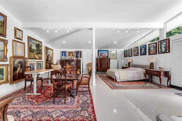 a living room with furniture and a rug