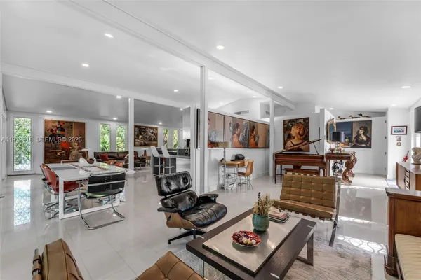 a living room with lots of furniture and gym equipment