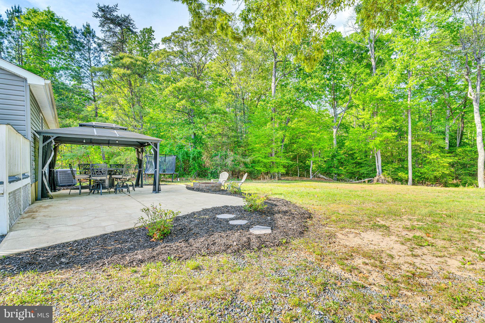 1195 Ball Road Port Republic, MD 20676 - Photo 22 of 23 a view of a backyard with a garden