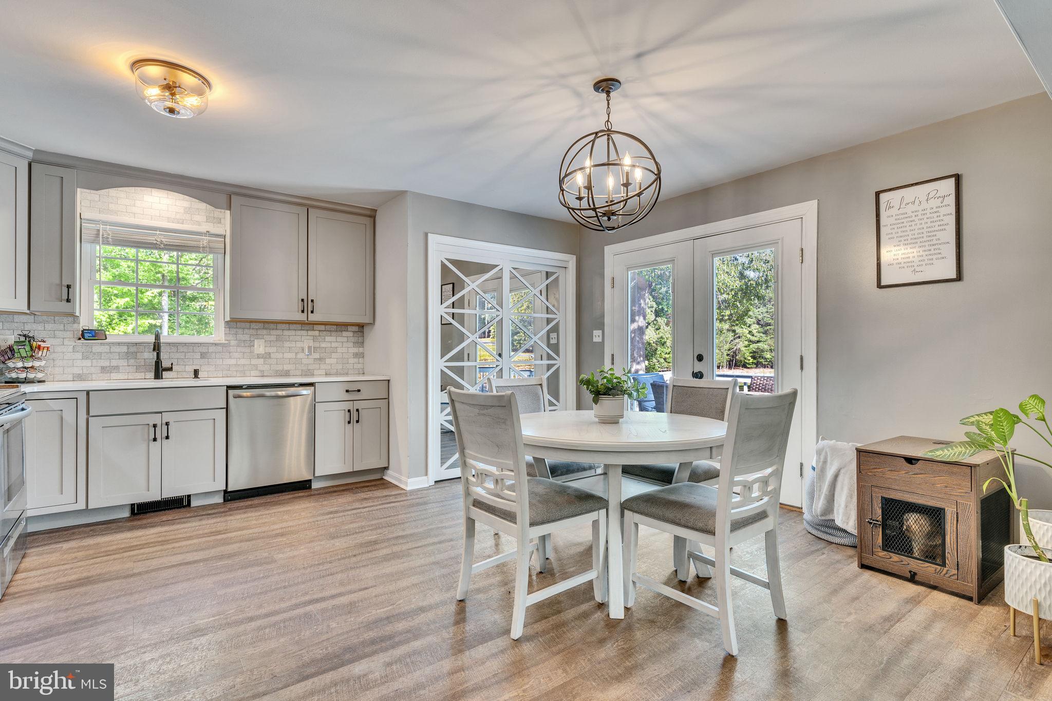 1195 Ball Road Port Republic, MD 20676 - Photo 5 of 23 a view of a dining room with furniture window and wooden floor