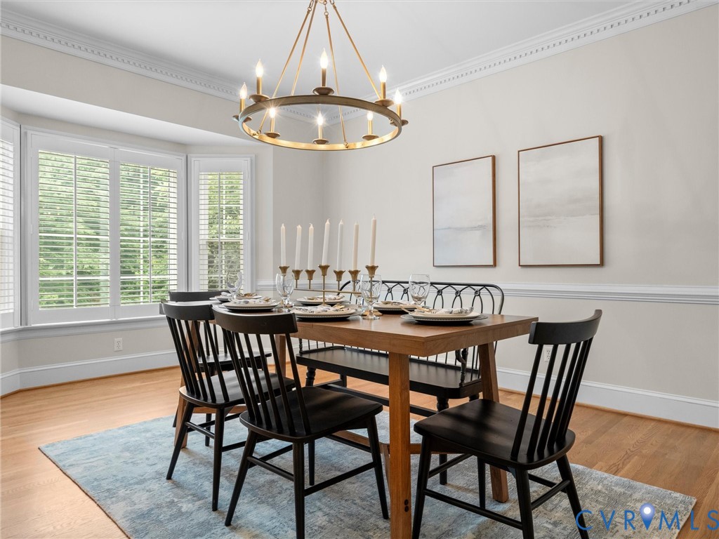 2011 Gamelaw Court Midlothian, VA 23113 - Photo 13 of 77 a view of a dining room with furniture window and wooden floor