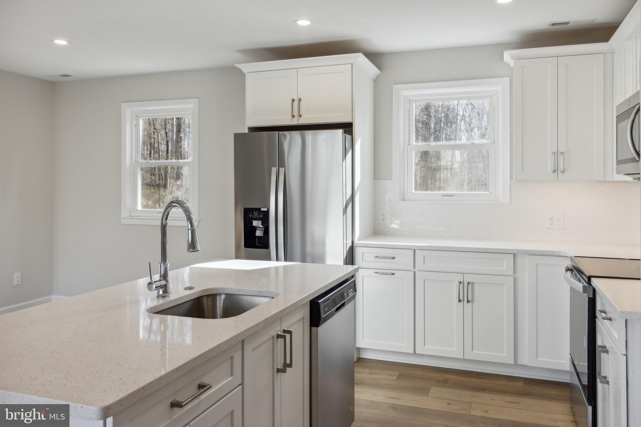 10105 Lyons Mill Road Randallstown, MD 21133 - Photo 11 of 33 White Shaker Cabinets & SS Appliances