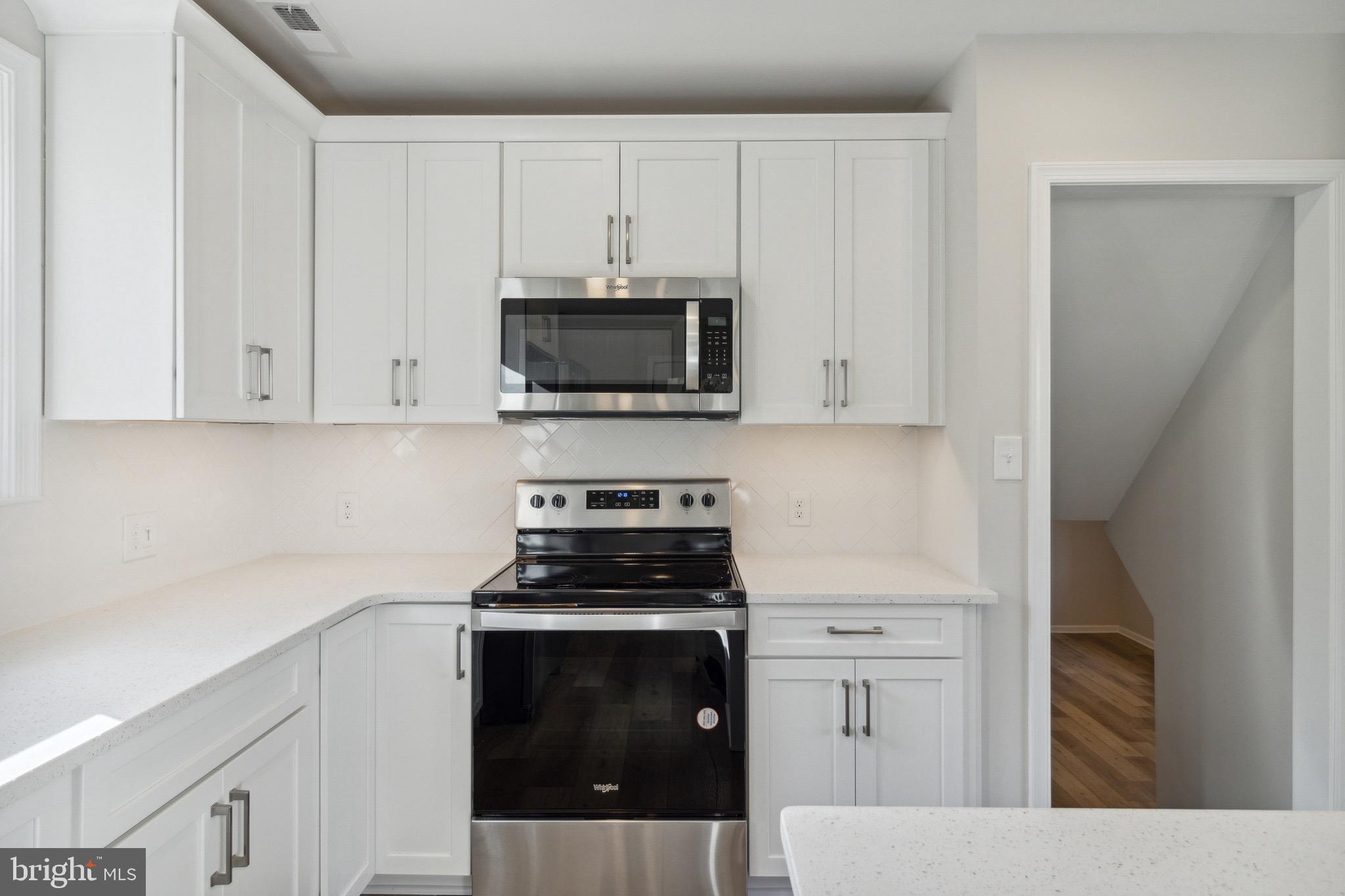 10105 Lyons Mill Road Randallstown, MD 21133 - Photo 13 of 33 White Shaker Cabinets & SS Appliances