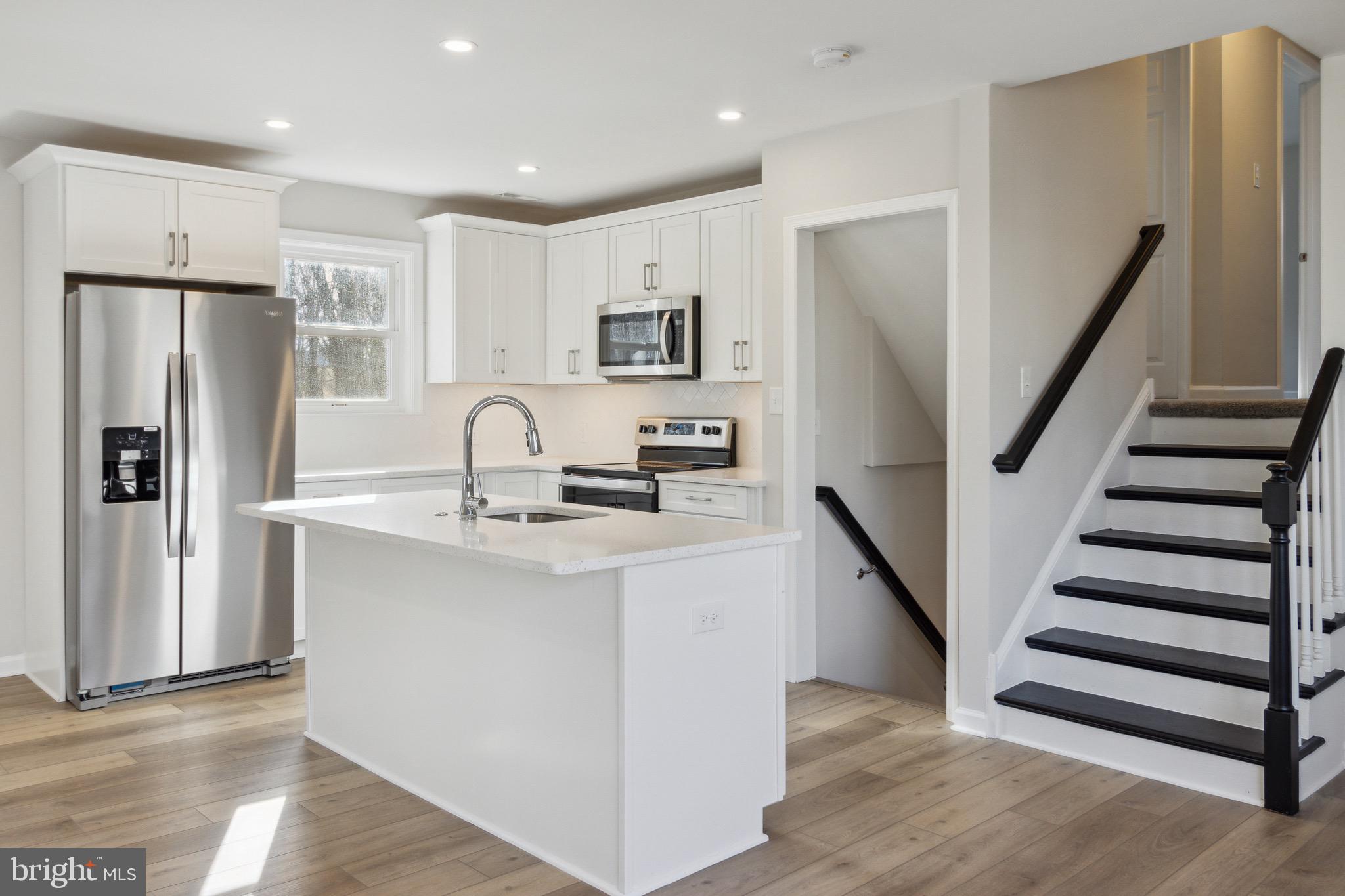 10105 Lyons Mill Road Randallstown, MD 21133 - Photo 10 of 33 White Shaker Cabinets & SS Appliances