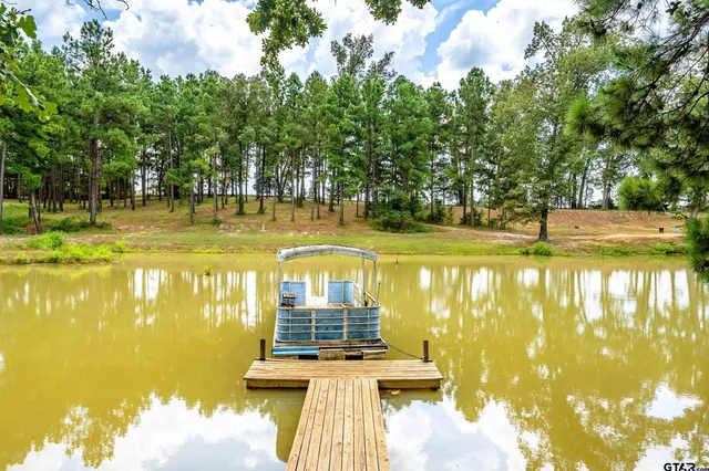 a view of a swimming pool with an outdoor space and seating area