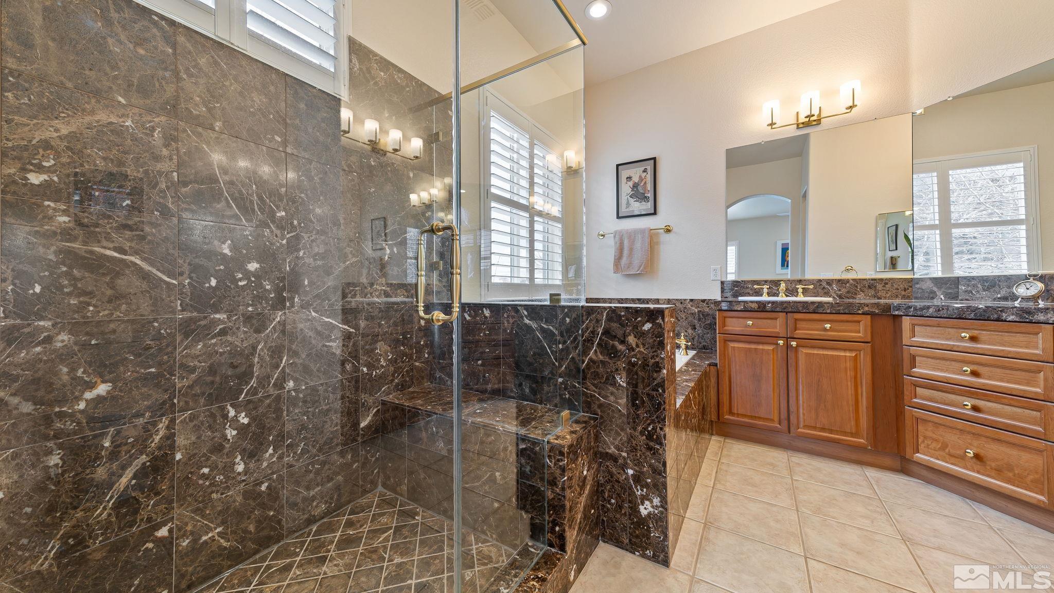 2085 Tesuque Court Reno, NV 89511 - Photo 30 of 40 a bathroom with a granite countertop sink a toilet and shower