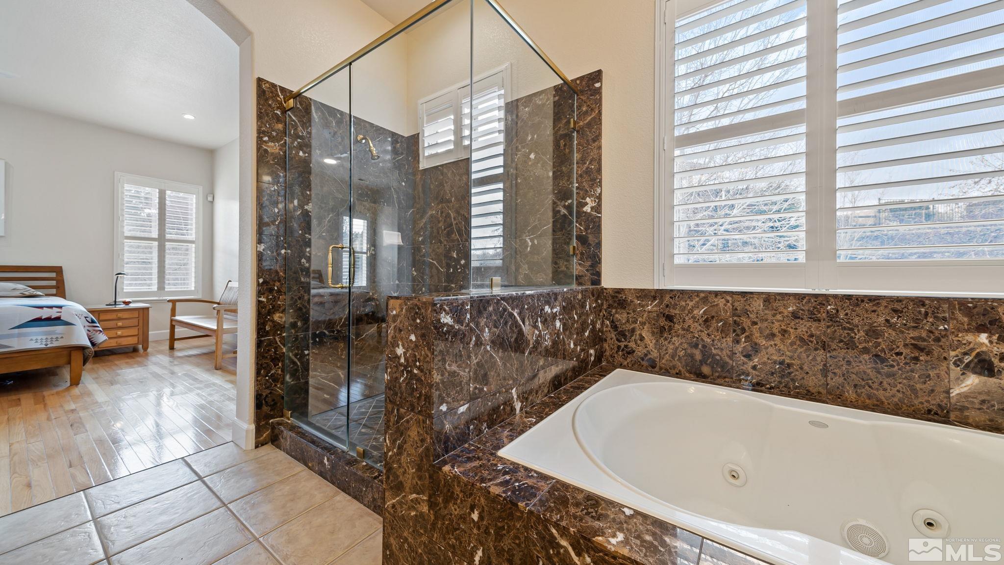 2085 Tesuque Court Reno, NV 89511 - Photo 31 of 40 a bathroom with a bathtub and shower