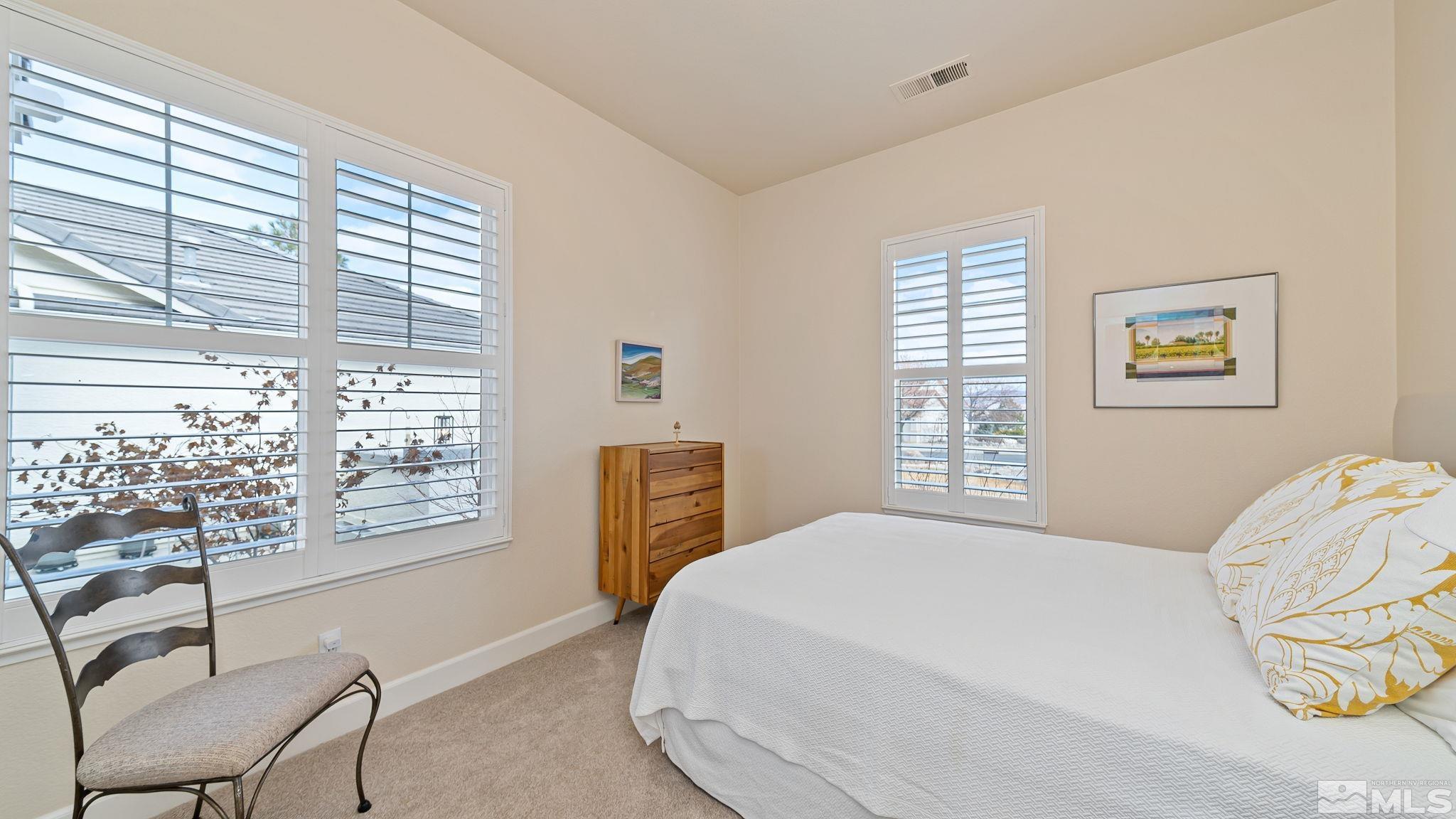 2085 Tesuque Court Reno, NV 89511 - Photo 32 of 40 a bedroom with a large window and a bed