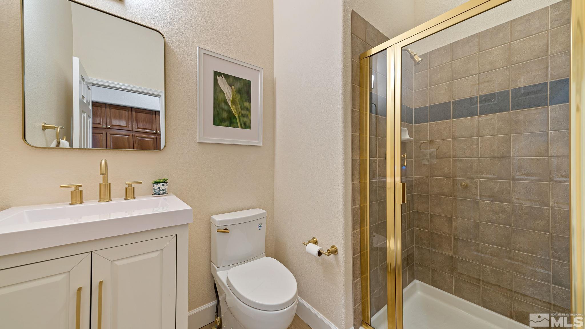 2085 Tesuque Court Reno, NV 89511 - Photo 33 of 40 a bathroom with a sink a toilet and shower