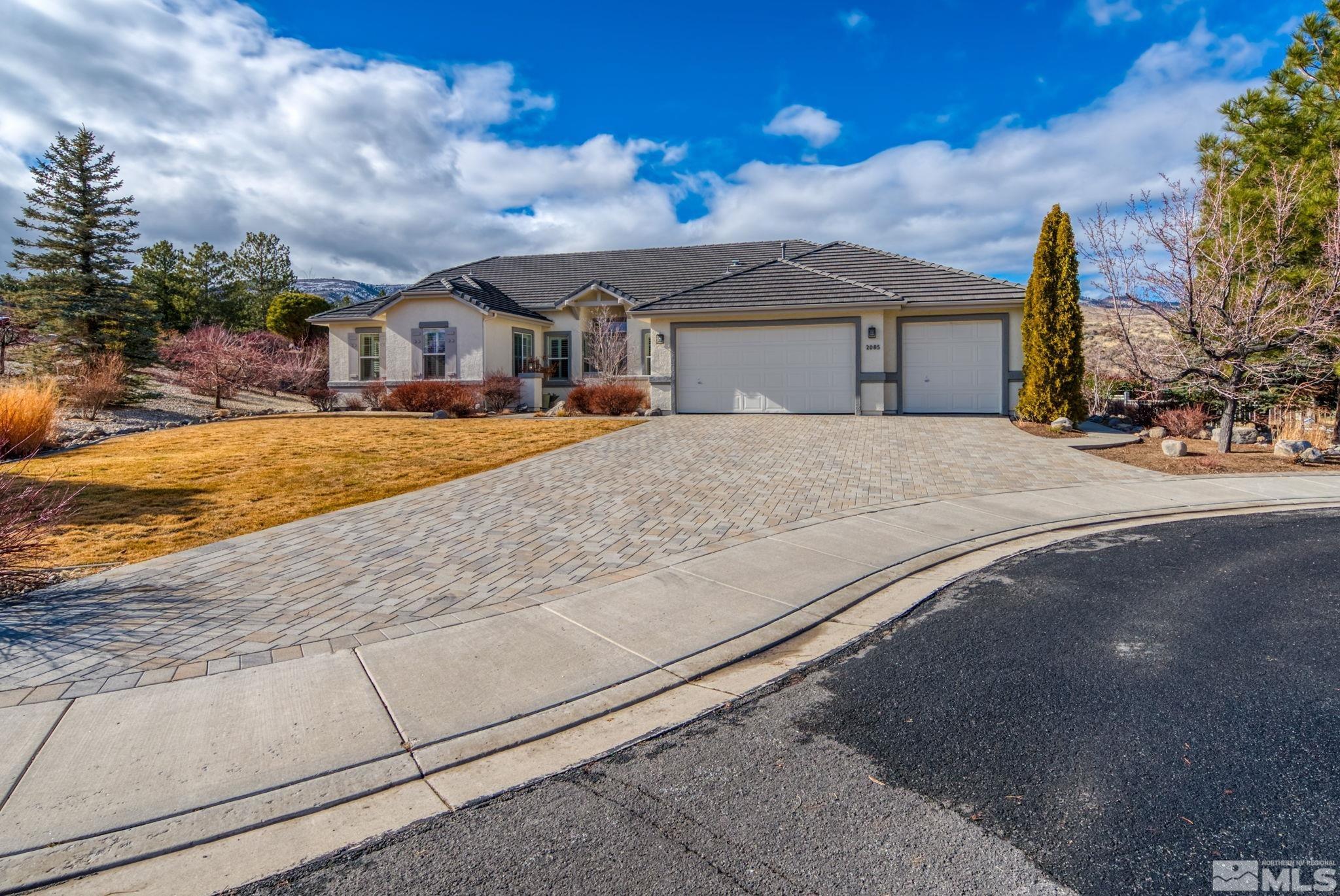 2085 Tesuque Court Reno, NV 89511 - Photo 4 of 40 a front view of a house with a yard
