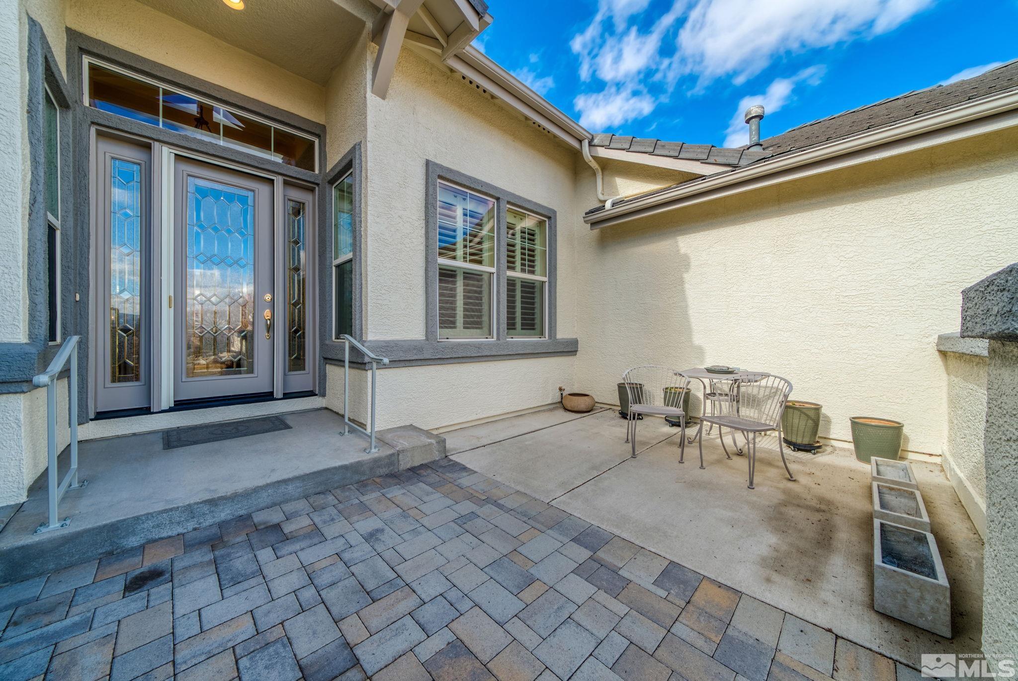 2085 Tesuque Court Reno, NV 89511 - Photo 5 of 40 a view of a patio with table and chairs and potted plants