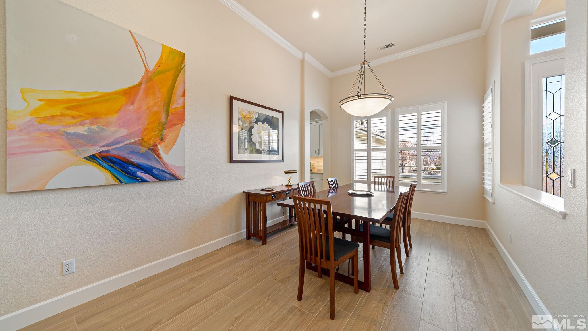 2085 Tesuque Court Reno, NV 89511 - Photo 7 of 40 a view of a dining room with furniture window and wooden floor