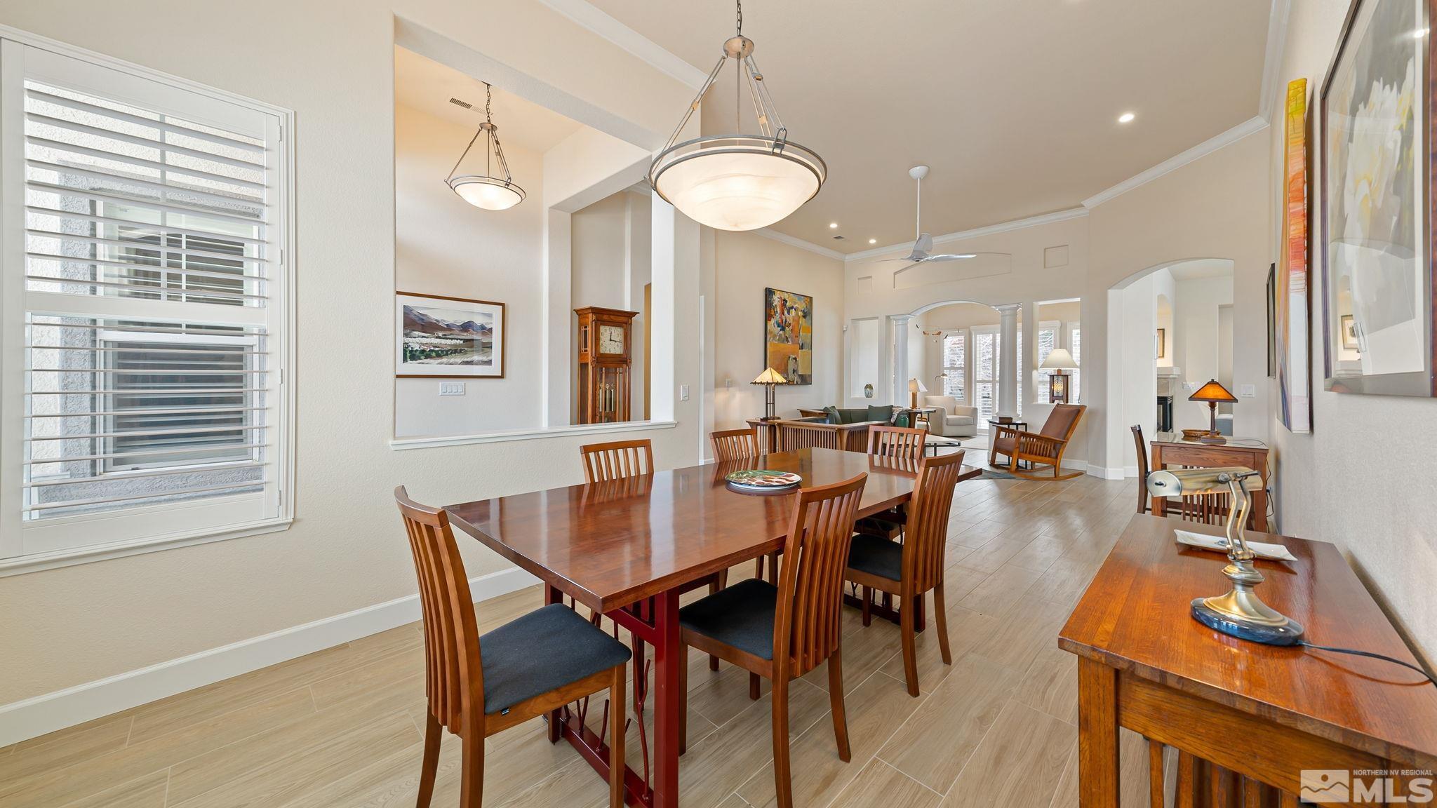 2085 Tesuque Court Reno, NV 89511 - Photo 8 of 40 a view of a dining room with furniture and a chandelier
