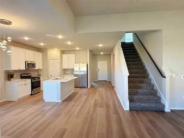 a bathroom with a double vanity sink and mirror