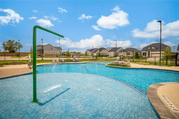 a view of swimming pool with outdoor seating
