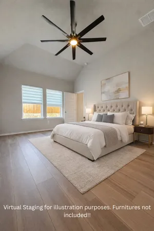 a bedroom with a large bed and a window