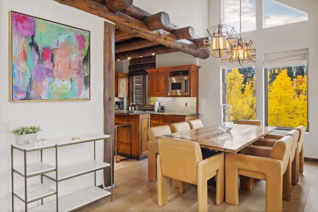 a dining room with furniture and window