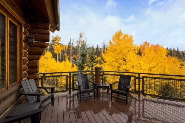a view of a balcony with floor to ceiling windows
