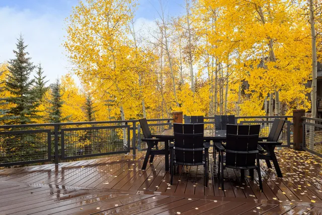 a living room with furniture fireplace and a large window