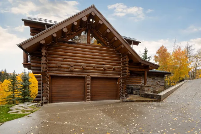 a living room with a bed furniture and a window