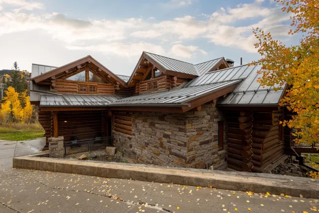 a bedroom with a large bed and a large window