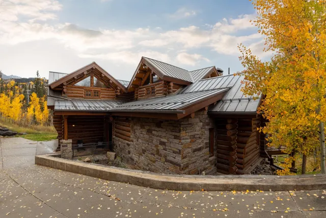 a spacious bedroom with a large bed and a large window
