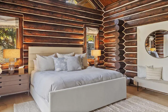 a bedroom with bed and window