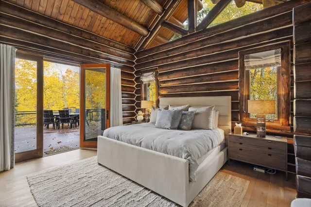 a bathroom with a granite countertop sink a mirror and a shower