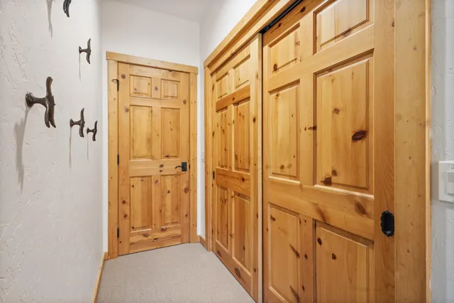a bathroom with a granite countertop sink a mirror and a shower