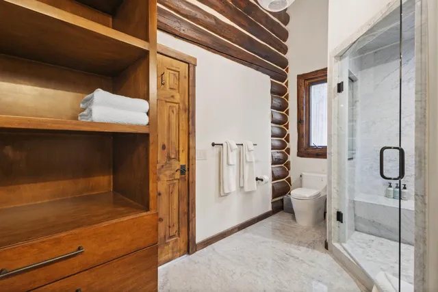a utility room with granite countertop a sink a washer and dryer