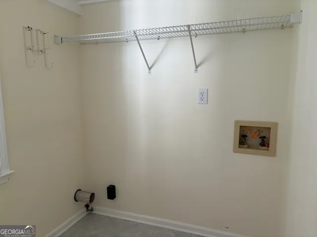 a bathroom with a shower and a shower head