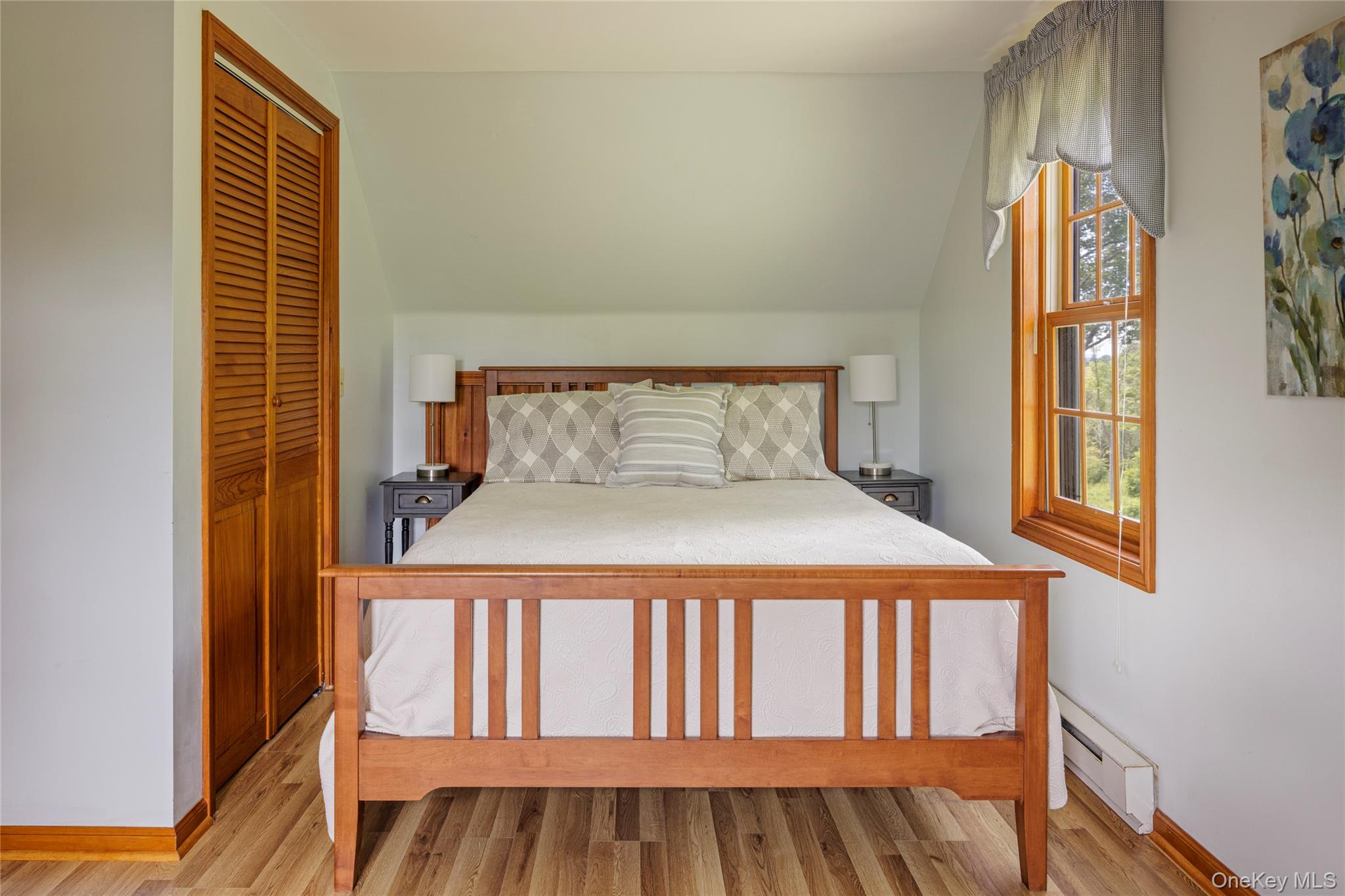 48 County Rte 14 Hudson, NY 12534 - Photo 41 of 48 Bedroom featuring baseboard heating, light wood finished floors, and a closet