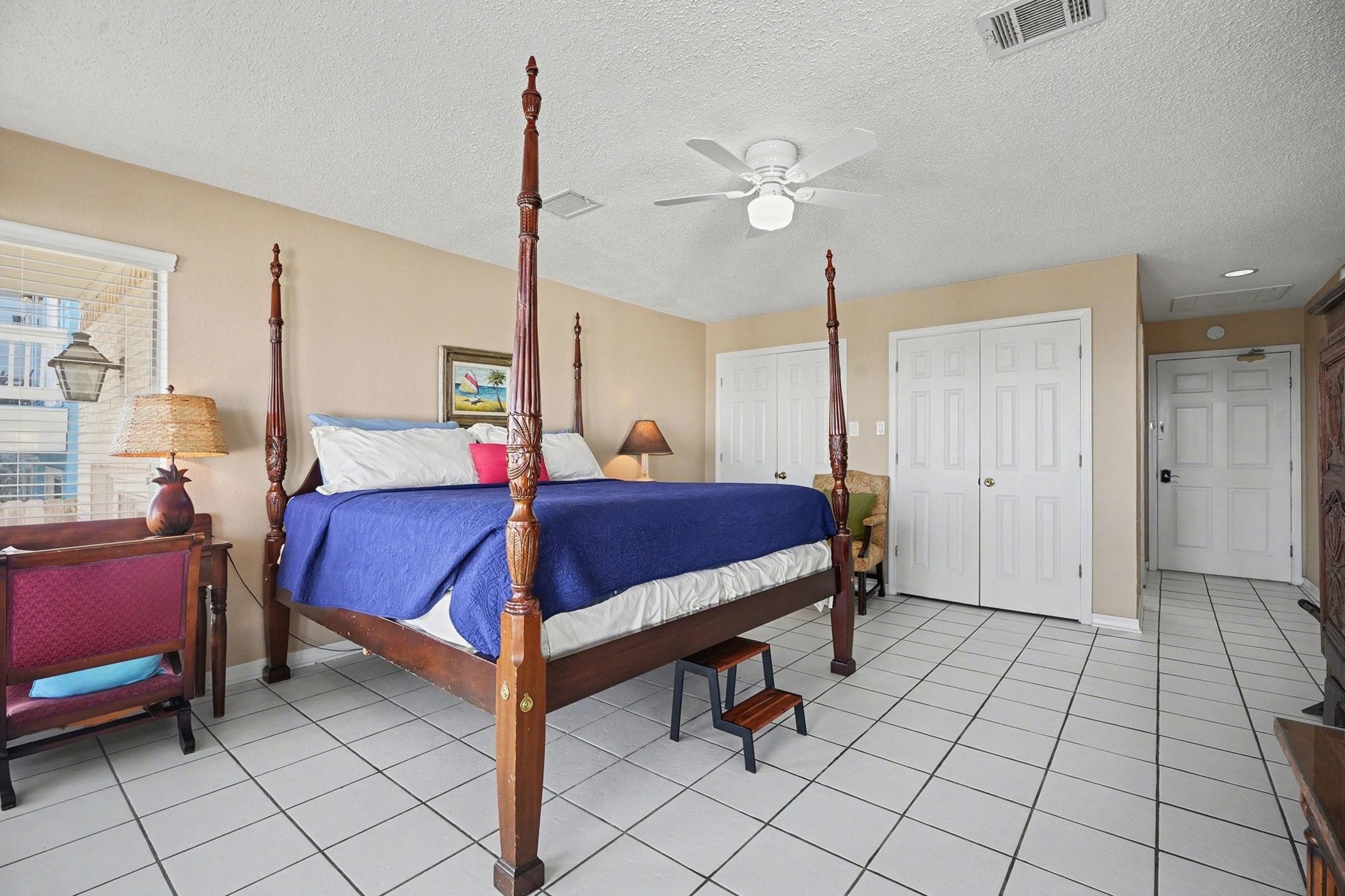 503 Bay Avenue Kemah, TX 77565 - Photo 16 of 47 a spacious bedroom with a bed and a chandelier