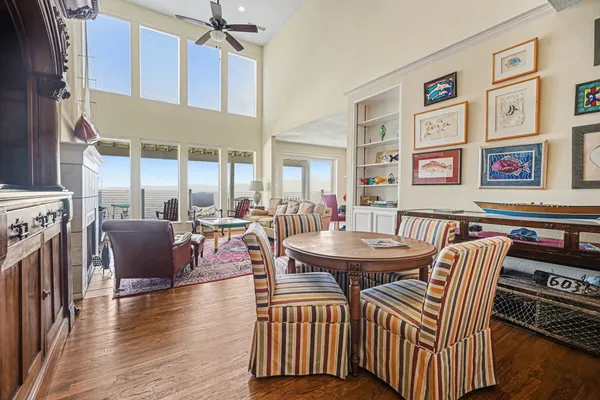 a living room with furniture a table and a painting on the wall