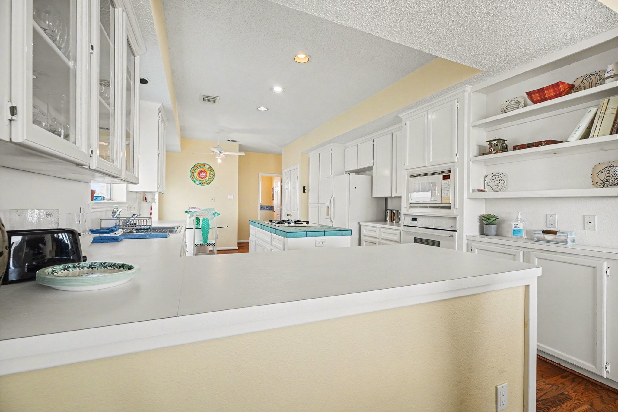 503 Bay Avenue Kemah, TX 77565 - Photo 25 of 47 a kitchen with stainless steel appliances a sink a stove a refrigerator cabinets and a counter top space