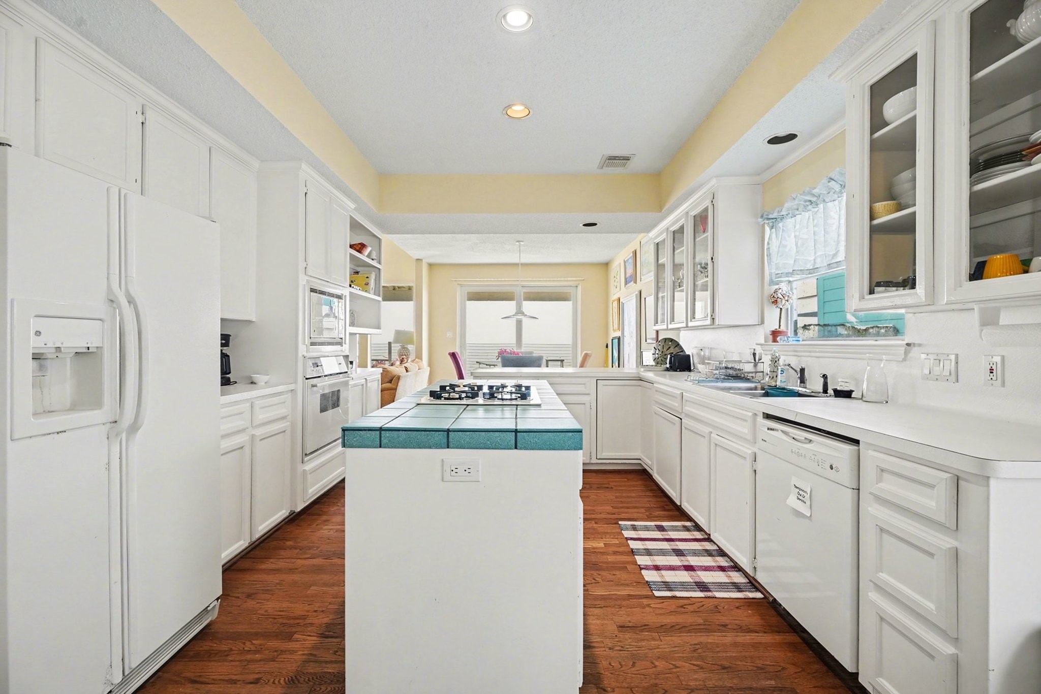 503 Bay Avenue Kemah, TX 77565 - Photo 26 of 47 a kitchen with white cabinets and white appliances