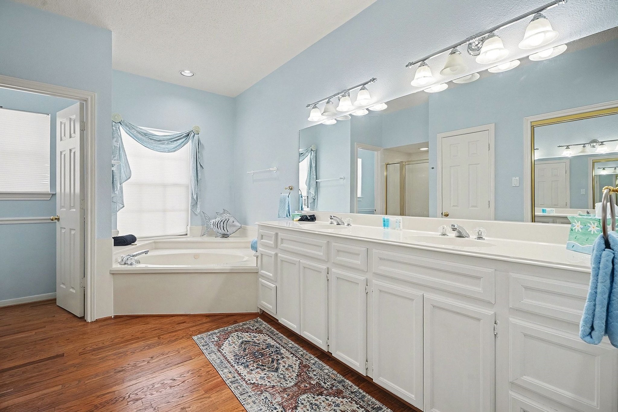 503 Bay Avenue Kemah, TX 77565 - Photo 34 of 47 a spacious bathroom with a double vanity sink and a mirror