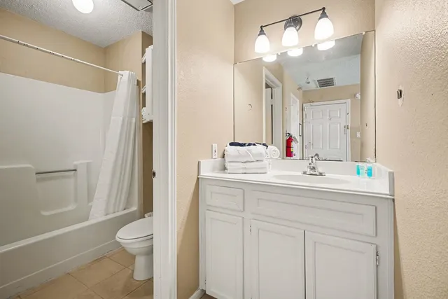 a balcony with view of swimming pool