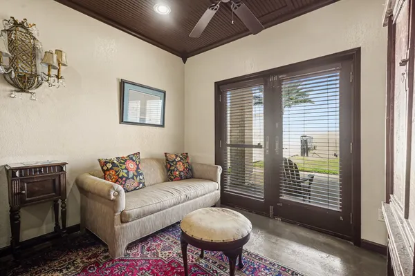 a living room with furniture and a window