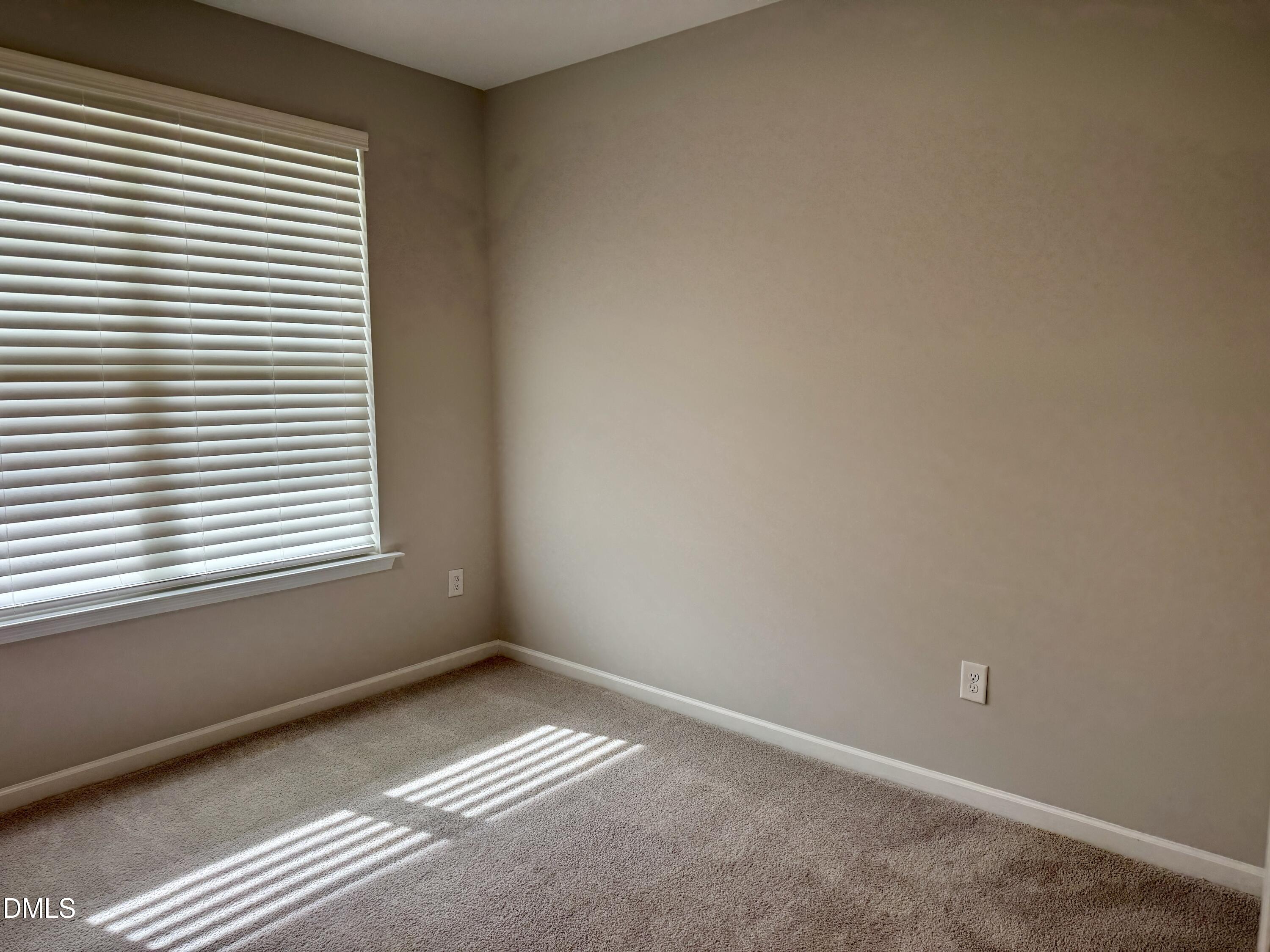 136 Durie Way Garner, NC 27529 - Photo 16 of 30 a view of an empty room with a window