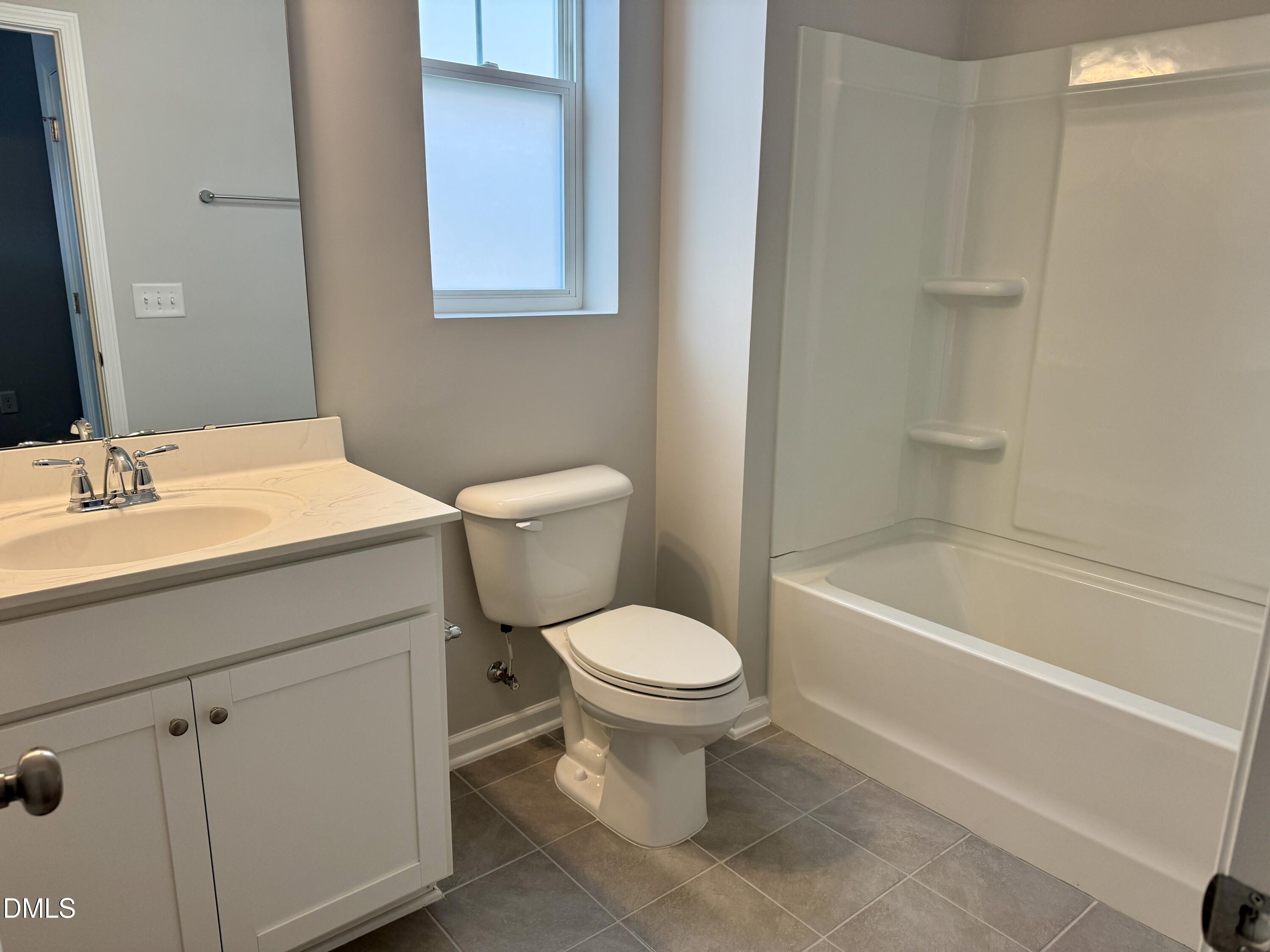 136 Durie Way Garner, NC 27529 - Photo 17 of 30 a bathroom with a sink toilet and bathtub