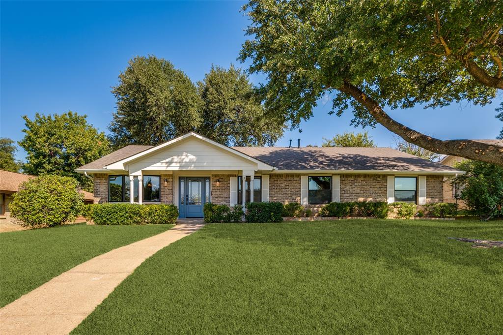 3161 Lockmoor Lane Dallas, TX 75220 - Photo 1 of 25 a front view of a house with a garden
