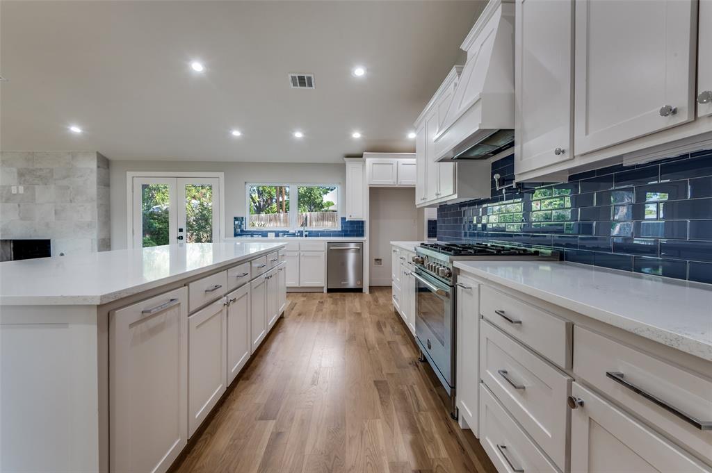 3161 Lockmoor Lane Dallas, TX 75220 - Photo 12 of 25 a large kitchen with stainless steel appliances lots of counter space sink and cabinets