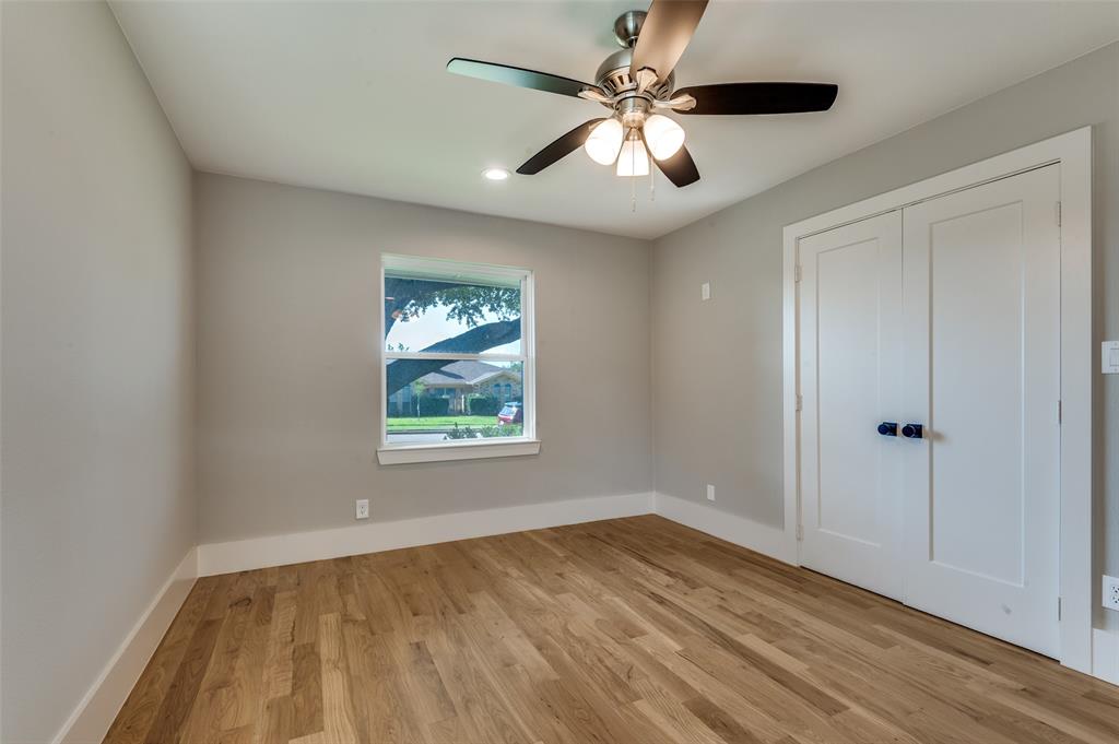 3161 Lockmoor Lane Dallas, TX 75220 - Photo 15 of 25 wooden floor in an empty room with a window