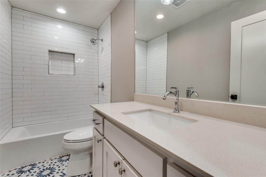 3161 Lockmoor Lane Dallas, TX 75220 - Photo 16 of 25 a bathroom with a sink toilet vanity and shower