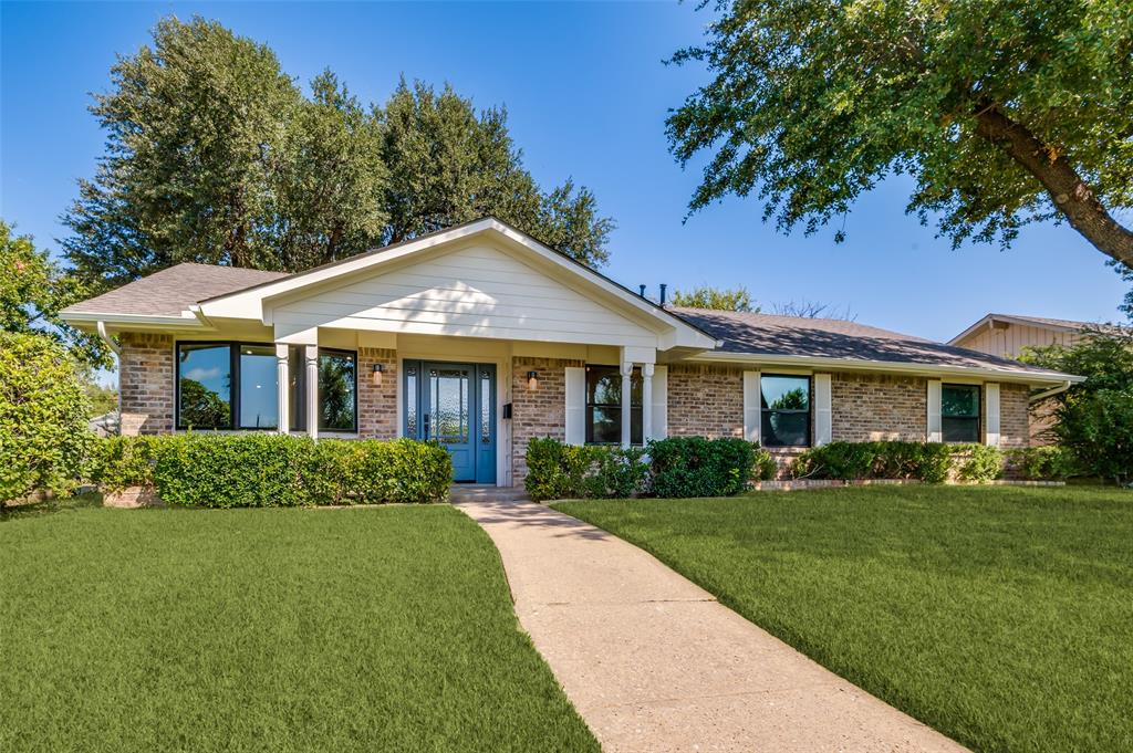 3161 Lockmoor Lane Dallas, TX 75220 - Photo 2 of 25 a front view of a house with a yard