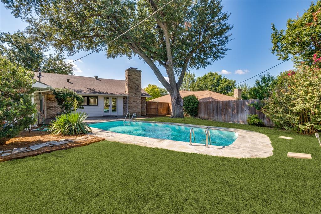 3161 Lockmoor Lane Dallas, TX 75220 - Photo 24 of 25 a front view of a house with a yard