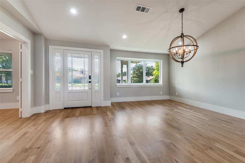 3161 Lockmoor Lane Dallas, TX 75220 - Photo 3 of 25 a view of a room with wooden floor cabinet and windows